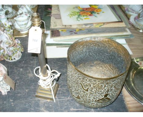 A Gilt metal Corinthian column table lamp and an eastern brass jardinere embossed with scrolling leaves, animals and figures.