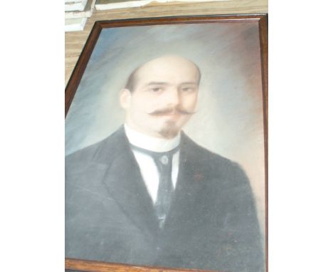 A 19th Century portrait of a gentleman, the painting depicting a young gentleman with beard and moustache, wearing frock coat