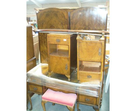 A Mid 20th century walnut bedroom suite comprising double wardrobe, a pair of bedside cupboards , Queen Anne style dressing t