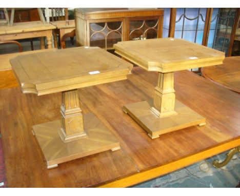 A Pair of hardwood pedestal lamp tables.