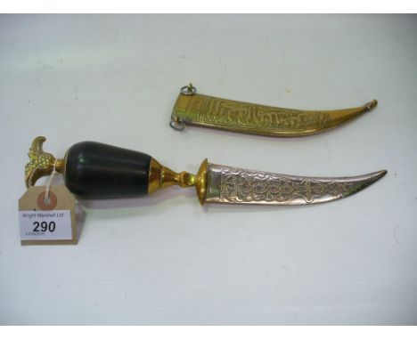 An Eastern brass ornamental dagger and scabbard.