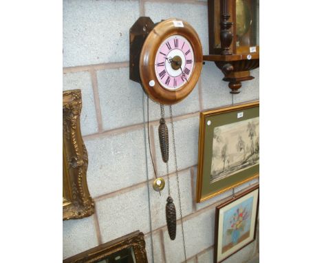 An Early 20th century mahogany cased postman's wall clock with a pink and white enamel dial.