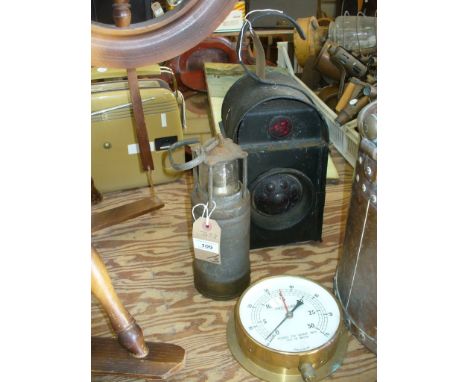 A Vintage Kenyons Serilight lens lamp, an Oldham lighting Co miners lamp and a brass cased pressure gauge. (3)