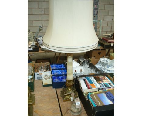 A Modern gilt metal mounted onyx column table lamp and a second pottery table lamp. (2)