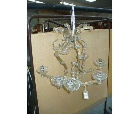 An early 20th Century cut glass chandelier
The original light branch chandelier (now missing two branches), suspended  from a