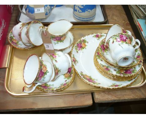 A Royal Albert " Old Country Roses" tea service comprising 6 cups, saucers and side plates , a sandwich plate , milk jug and 