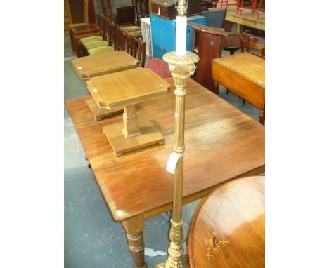A 19th Century gilt wood lamp standard with a fluted and acanthus leaf column raised on three leaf moulded down swept support