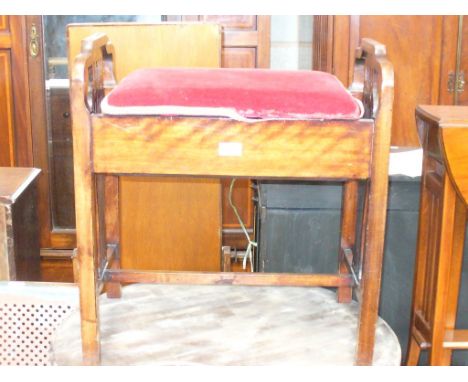 An Early 20th Century stained beech wood piano stool raised on two pierced  supports.