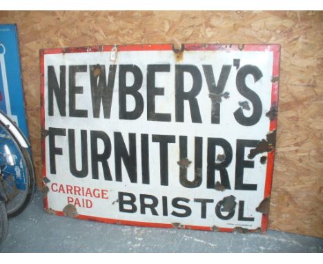 An Enamel Sign of Newbery's Furniture Bristol, of large rectangular form, the black writing to a white background border with