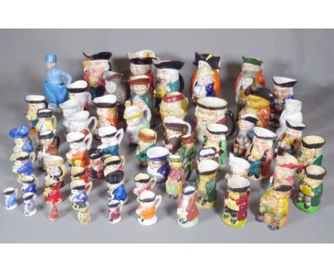 A quantity of ceramic Toby jugs, including Doulton, Staffordshire and others, (qty). 