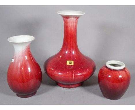 A group of three 20th century Asian sang de boeuf ceramic vases, the largest 40cm tall.