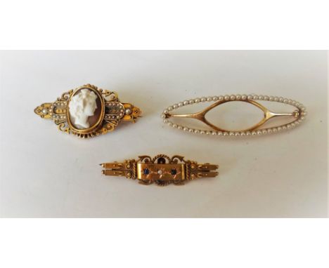 A Victorian gold, shell cameo and seed pearl set brooch, carved as the portrait of a lady between seed pearl set sides, a 15c