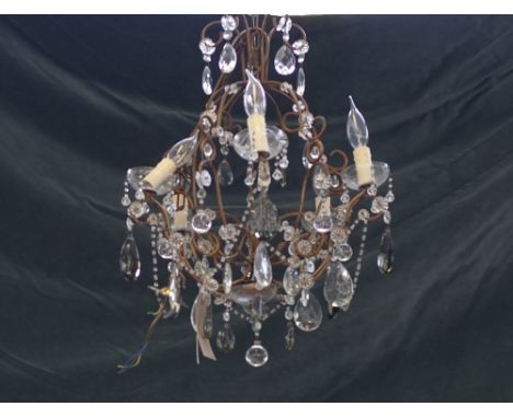 A modern gilt metal five branch chandelier, the stem issuing five swan neck branches united by beaded chains and hung with cl