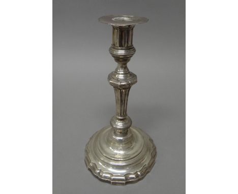 A French table candlestick, of 18th century style, armorial engraved, raised on a shaped circular base and having a detachabl