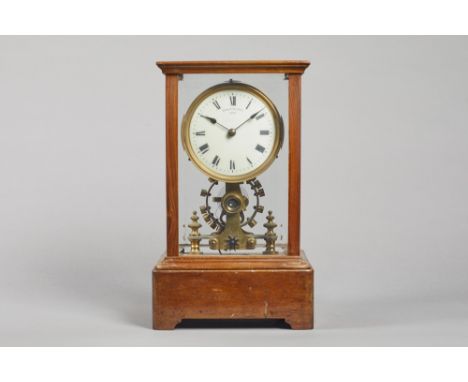 A Walnut cased Eureka electric timepieceNo. 7077, Dated 1906In a rectangular five bevelled glazed panel case, on plinth base,