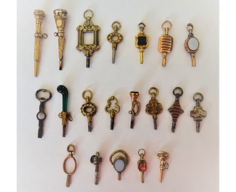 Two cut steel watch keys, a shield shaped bloodstone set watch key, a cornelian set watch key, modelled as a bugle and sixtee