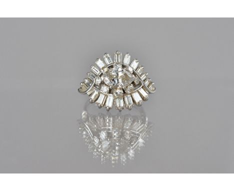 A diamond cluster ring, claw set with the principal marquise diamond to the centre, in a surround of eight circular cut diamo