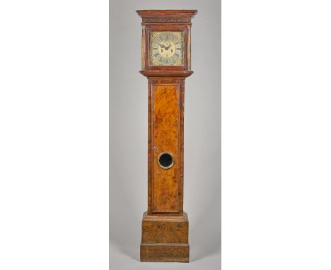 A Queen Anne walnut longcase clockBy Thomas Walkden, London, circa 1705 and laterThe hood with a moulded pediment above a bli