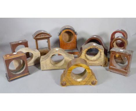 A large quantity of mainly mahogany late 19th and early 20th century mantel clock cases, (qty). 