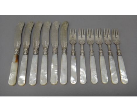 A set of six Victorian pairs of silver dessert or fruit knives and forks, with engraved decoration and with mother-of-pearl h