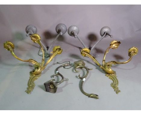 A pair of late 19th century Rococo Revival lacquered brass three branch candle sconces, 35cm high, a pair of shieldback twin 