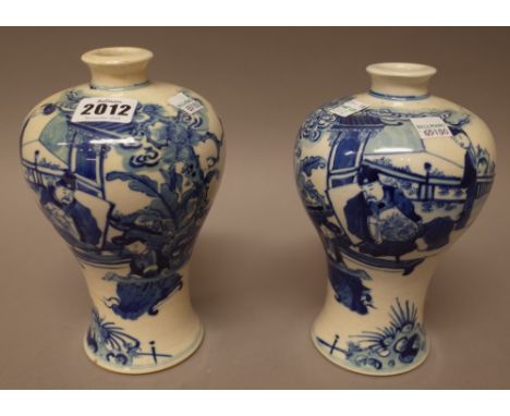 A pair of Chinese blue and white baluster vases, late 19th century, painted with an official and a woman playing the koto in 