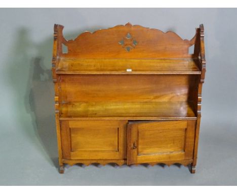 A 19th century mahogany Gothic Revival hanging shelf, 49cm wide. 