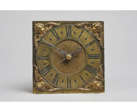 A small James II/Queen Anne weight-driven timepieceBy Michael Cheltenham, LondonThe 6in. square brass dial with cherub head s