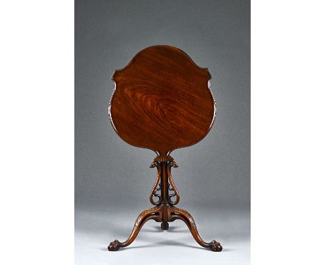 A Victorian mahogany occasional table, the shaped snap-top on a fluted column mounted with three opposing serpents on tripod 