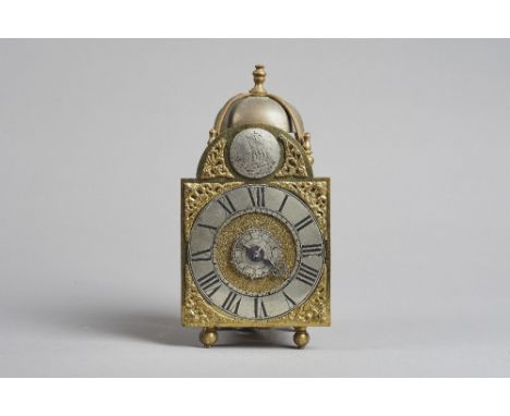 A George III lantern timepiece alarmSurmounted by a bell and five turned finials, with 4 1/4in. arched brass dial, silvered c