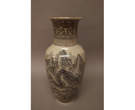 A Chinese porcelain baluster vase, 20th century, painted in tones of grey with a mountainous landscape with pavilions against