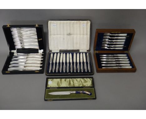 A set of six pairs of plated dessert or fruit knives and forks, with mother-of-pearl handles, with an oak case, a set of twel