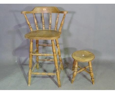 An early 20th century pine bar back stool and a pine circular stool on ring turned supports, (2). 