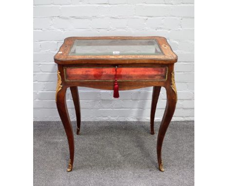 A 19th century French marquetry inlaid bijouterie table, the rectangular serpentine top with bevelled glass panel on cabriole