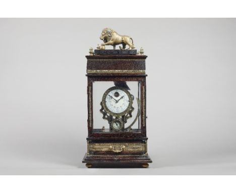 A&nbsp; giltmetal-mounted stained wood rolling ball timepiece 20th Century Surmounted by a figure of a lion with four finials