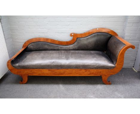A mid 19th century North European Biedermeier birch sofa with rollover ends on squat splayed sabre supports, 220cm wide x 93c