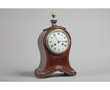 An Edwardian mahogany and boxwood line-inlaid balloon bracket clock The shaped case surmounted by a brass finial, above the c