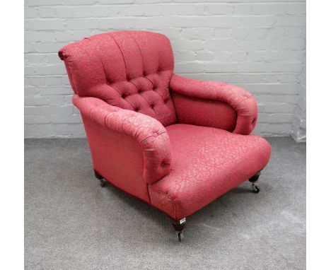 A mid Victorian easy armchair with button back and over stuffed arms on turned supports, 78cm wide x 84cm high. 