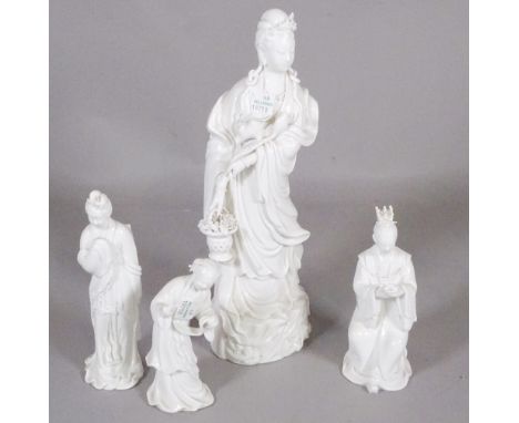Asian ceramics, a group of four 'blanc de chine' porcelain figures, largest 34cm high.
