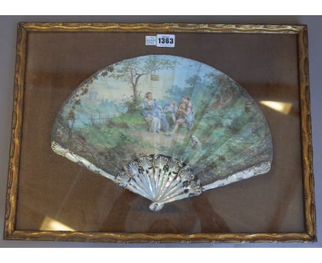 A French painted paper fan, late 18th century, signed 'CERCIER', depicting figures at leisure against a landscape, with gilt 