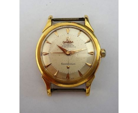 An Omega Constellation Automatic gold cased gentleman's wristwatch, the signed circular silvered dial with gilt arrow shaped 