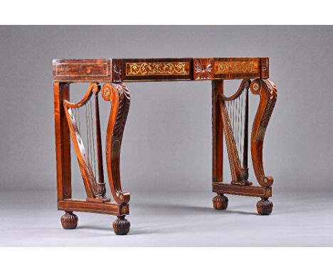 An early 19th century Irish brass inlaid mahogany and rosewood console table, the serpentine top on a pair of harp supports o