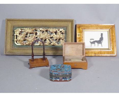 A small Chinese gilt carved panel depicting birds 43cm x 18cm, a cloisonné box, a rosewood watch stand, a marble music box an