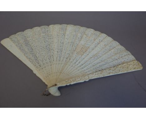 A 19th century Cantonese ivory brise fan, ornately carved and pierced with figures in a landscape, 25.5cm. 