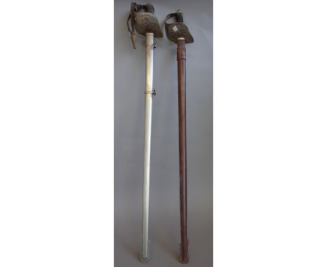 A George V Officer's dress sword and an Edwardian VII Officer's dress sword by 'Henley Brooks Ltd', each with engraved blade 