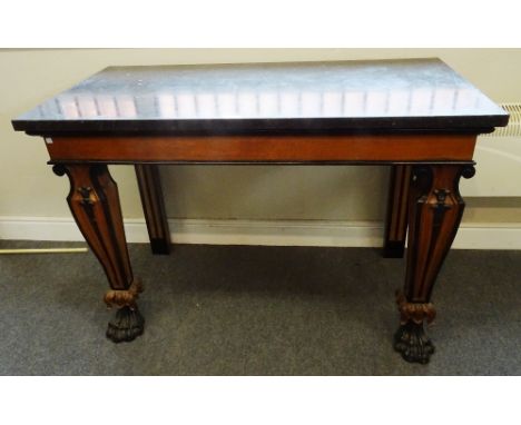 A Victorian console table, the rectangular black marble top on a part ebonised oak base, with tapering square supports, termi