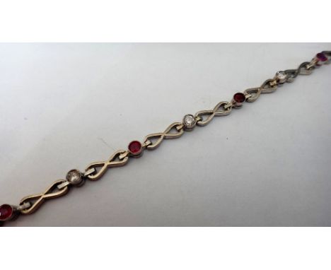 A ruby and diamond bracelet, collet set with a row of circular cut diamonds alternating with circular cut rubies and with fig