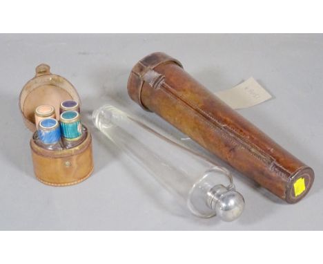 A 19th century leather cased hunting flask of tapering form, 27cm long and four scent bottles in a leather case, (2). 