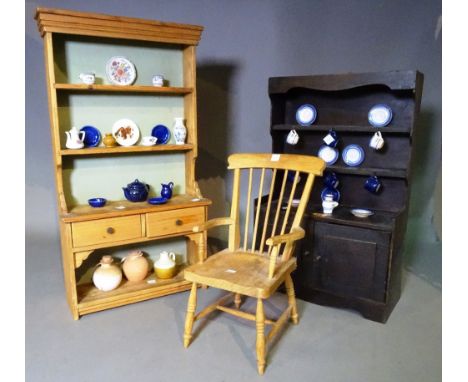 A quantity of miniature furniture comprising; two dressers, 35cm wide x 62cm high, a stickback open armchair, 32cm wide x 52c