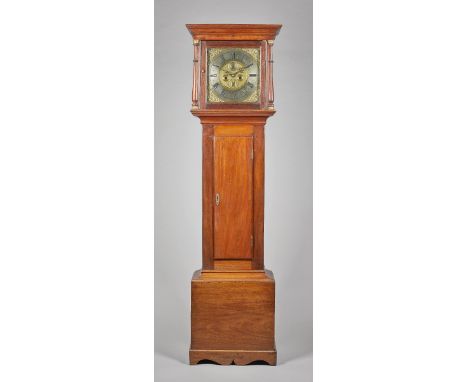 A  mahogany longcase clockBy John Groom, Colchester, the movement circa 1710, the case laterThe moulded pediment, above a pai